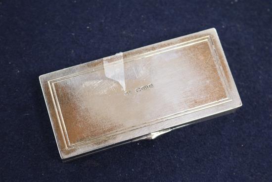 An Edwardian silver and enamel triple compartment stamp box, import marks for London, 1907, 8cm.